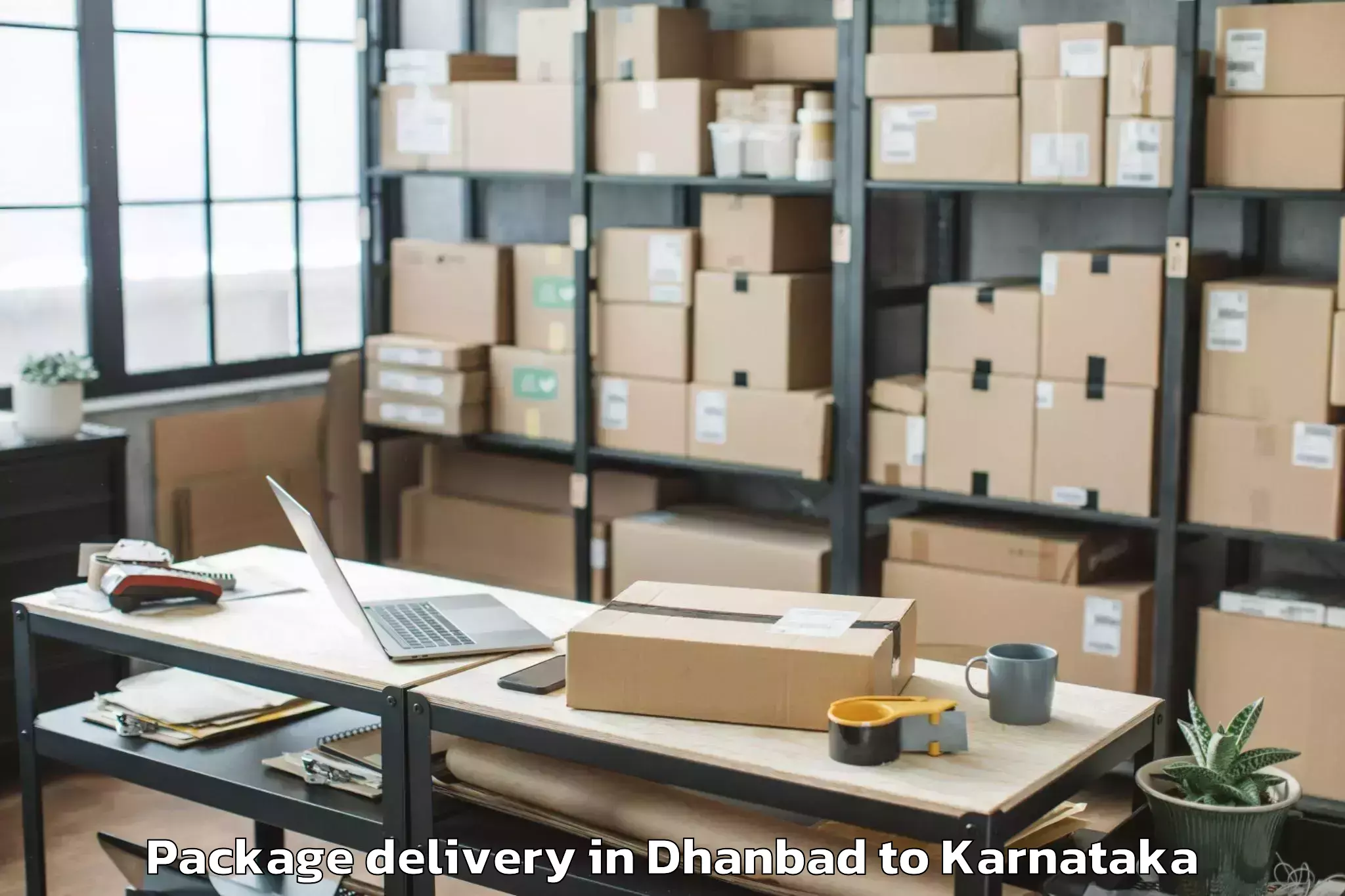 Easy Dhanbad to Karnataka Janapada Vishwavidya Package Delivery Booking